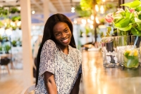 positive dark skinned mixed race female ejoys good rest coffee shop 231208 11073